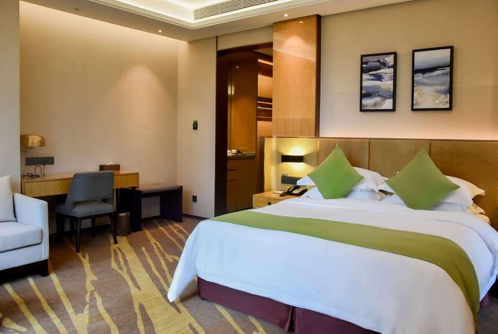 Leshan Ramada Hotel Quarto foto