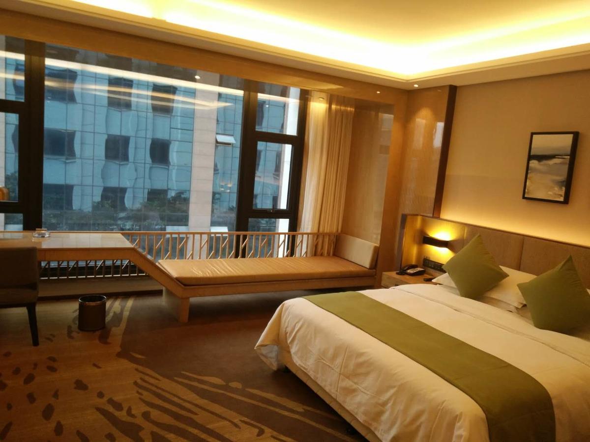 Leshan Ramada Hotel Quarto foto